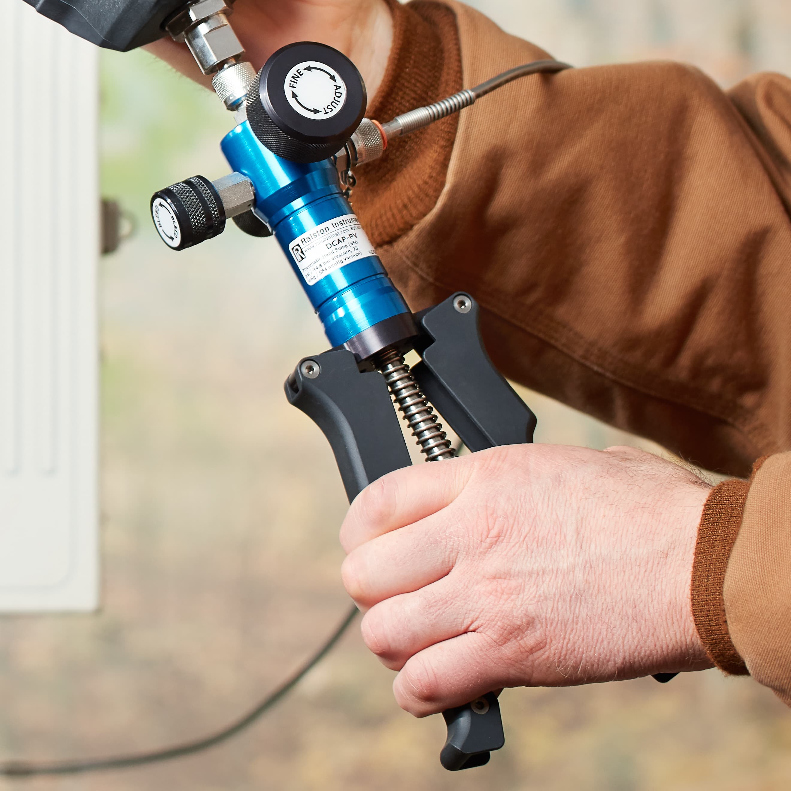 Ralston hand pump used for field calibration applications